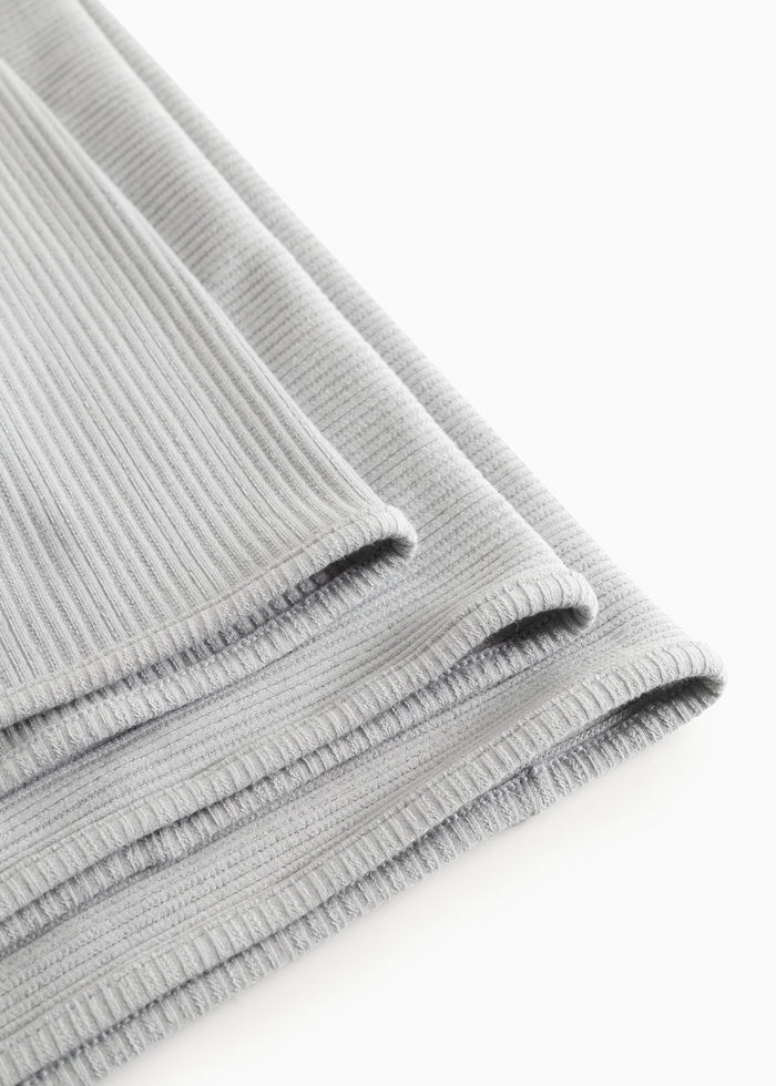 Lysed tear striped rug with folded edges