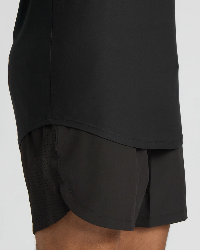 Black athletic shorts with a layered design on a white background