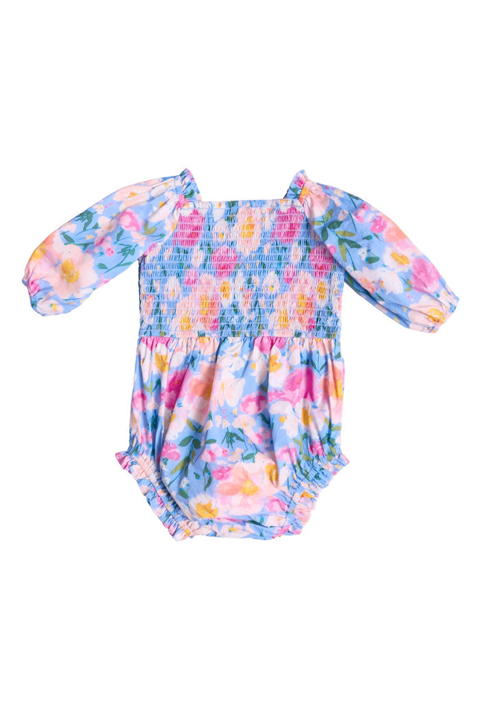 The Ivy City Co Baby Teagan Romper in Delia Blue features long sleeves and a vibrant floral pattern, with gathered elastic at the chest and legs—perfect for a sweet mommy-and-me look.