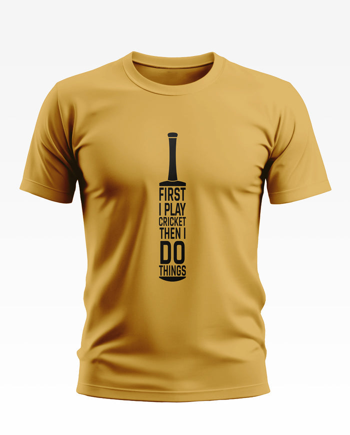 Yellow men's t-shirt with cricket bat graphic and 'First I play cricket then I do things' text