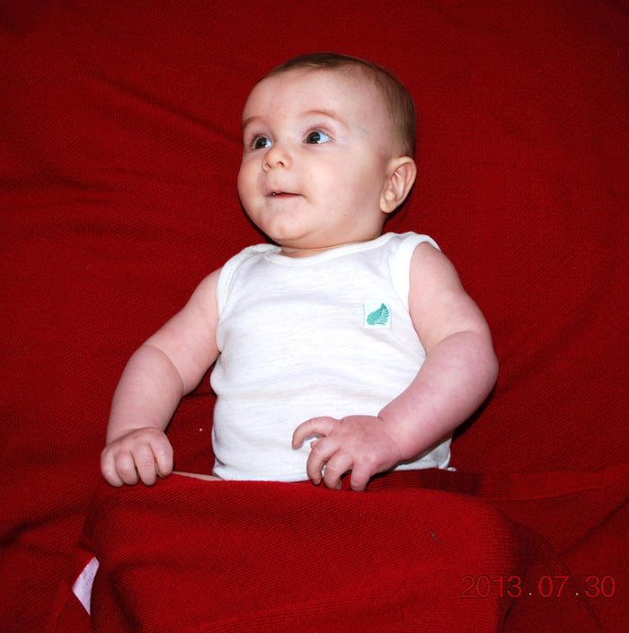 Merino wool baby’s singlet in Winter White colour.