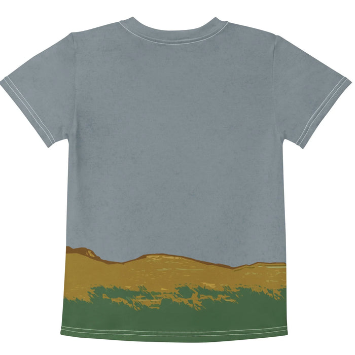 Hippity Hoppity Kid's Tee - The specific juxtaposition of a Beatrix Potter-style frog in terracotta trousers (#B94C38) brandishing a weapon alongside the lowercase "hippity hoppity" text, set against a dusty slate blue sky (#84939C).