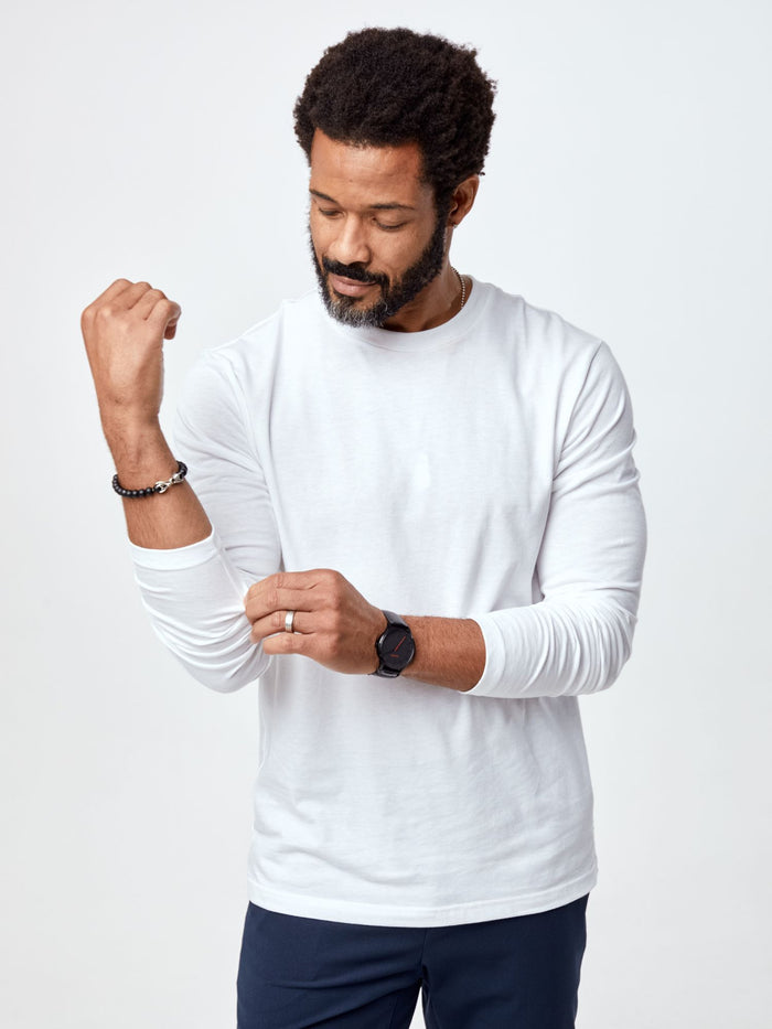 Jarrett is 6', 168lbs and wears a size M # Long Sleeve Crew Tee | White | Fresh Clean Threads