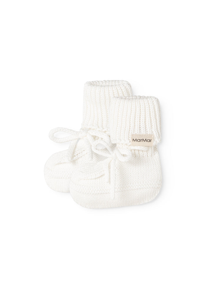 White ribbed lining with ribbing, bow, and MarMar logo on the cuff.