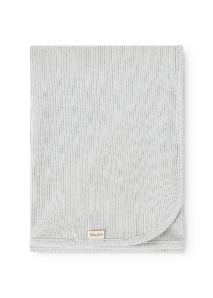 Lysgray ribbed blanket with sewn edge and label at the bottom.