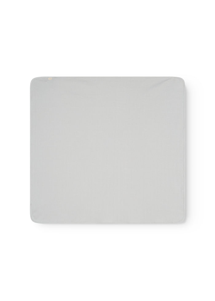 Square light gray rug with a smooth surface and slightly rounded corners.