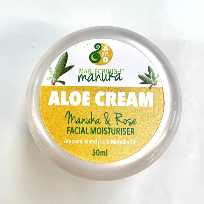 Top view of 50ml pot of face cream. Yellow and white label with white branding.