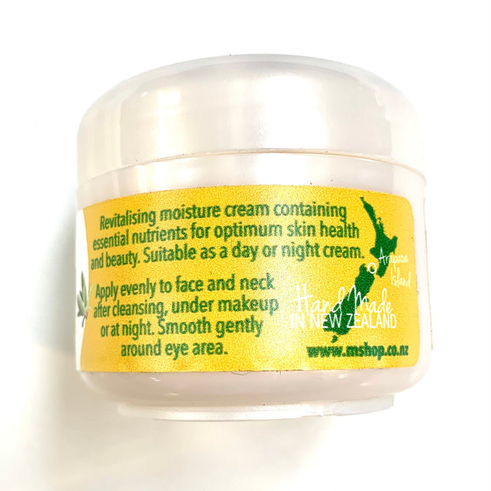 Side view of 50ml pot of face cream. Yellow label with instructions.