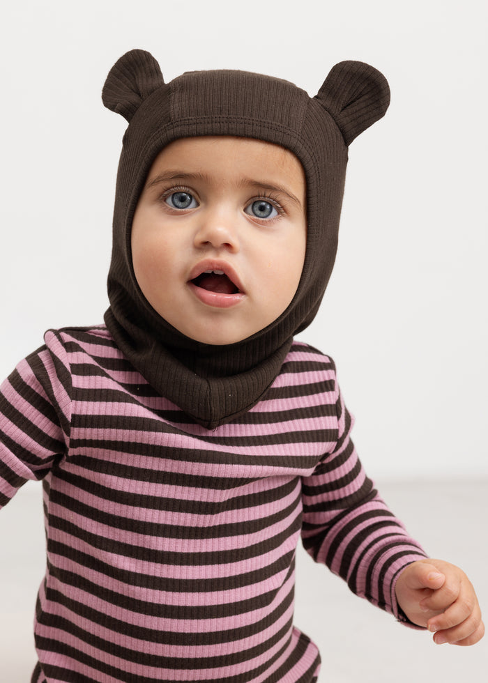 Elephant hat in dark brown with ear flaps for baby, in striped jumpsuit