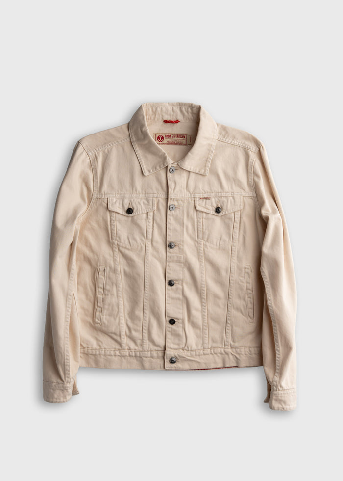 Men’s bull denim trucker jacket in Antique White, with button front, welt hand pockets and side cinch adjusters, durable cotton workwear outerwear with classic waist length fit and rugged construction