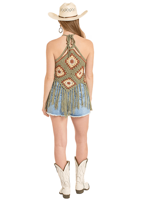 Woman in crochet top and denim shorts
