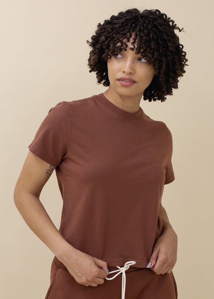 woman wearing basic crop tee in brick