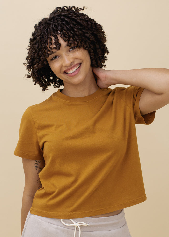 woman wearing basic crop tee in butterscotch