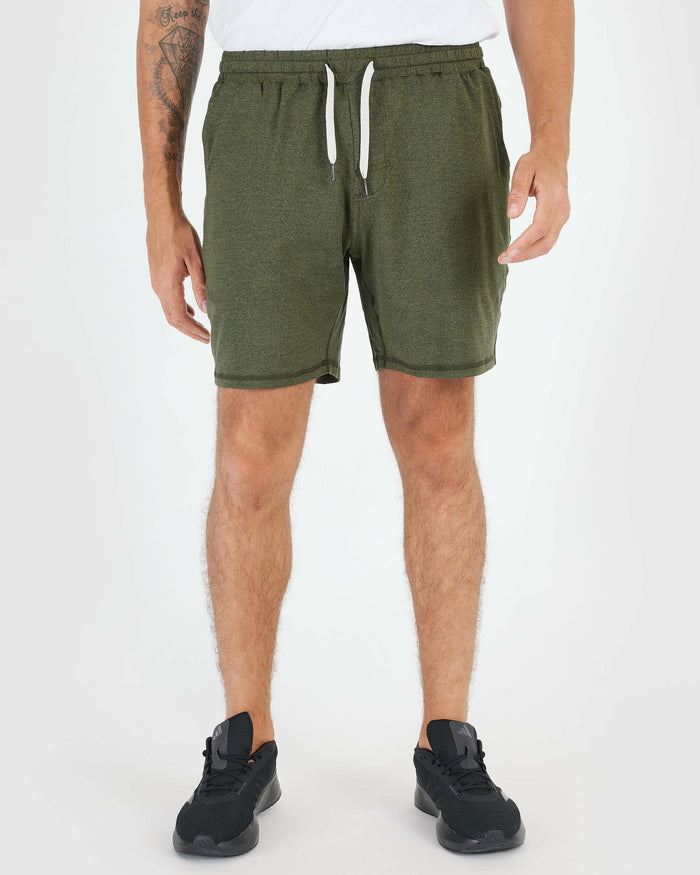 Dark Heather Military Green Active Comfort Short with black sneakers.