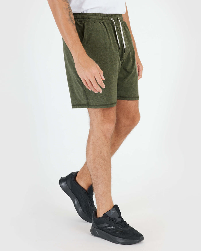 Person wearing Dark Heather Military Green Active Comfort Short and black running shoes.