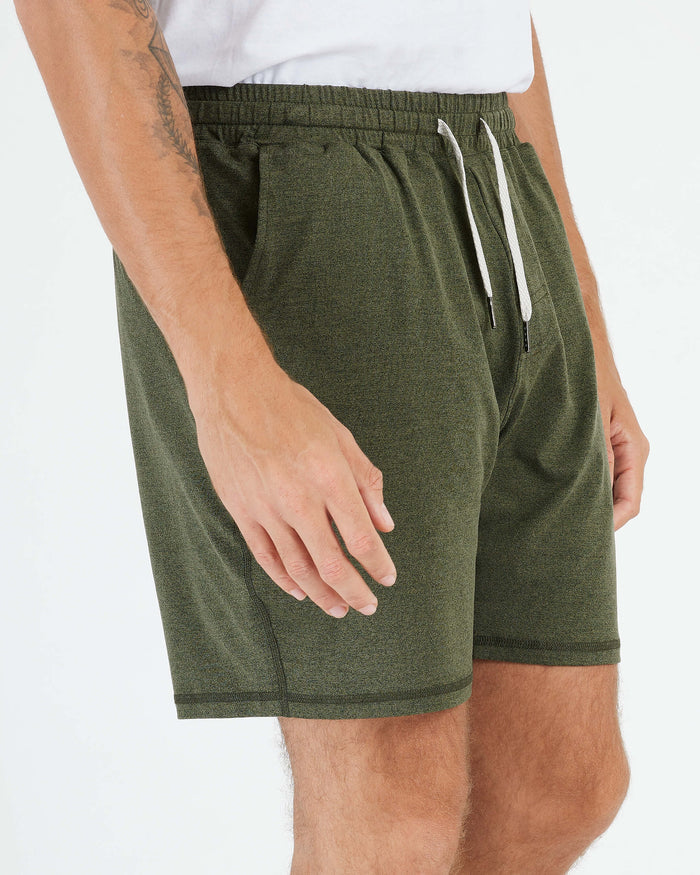 Wearing Dark Heather Military Green Active Comfort Short with side pockets.