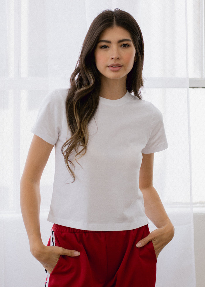 woman wearing crop tee in white