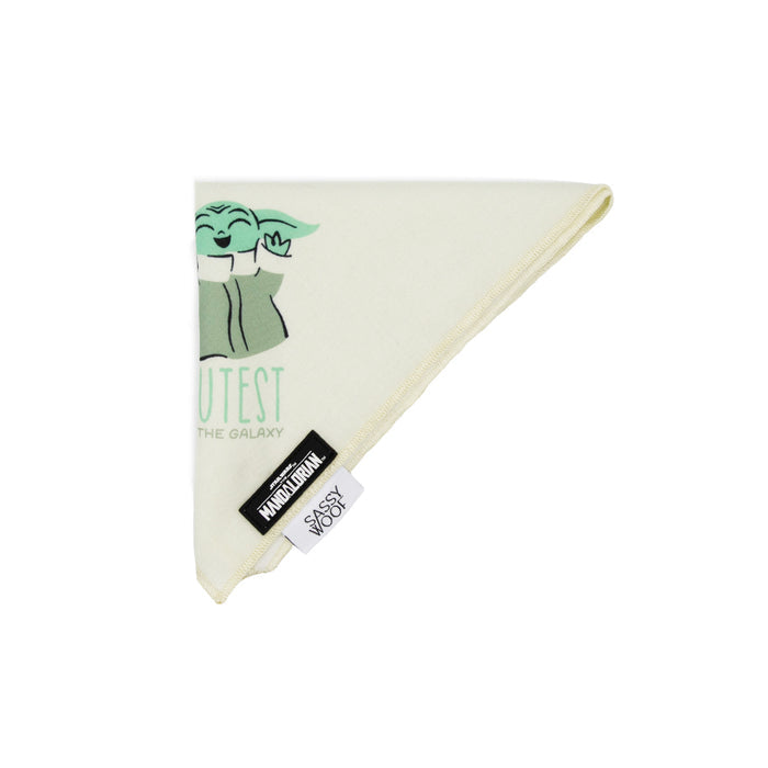 The Sassy Woof Dog Bandana - STAR WARS™ The Child™ is a cream-colored, triangle bandana featuring Baby Yoda and “Cutest in the Galaxy,” plus Sassy Woof and HANDMADE IN USA tags. Pair with a matching leash or harness for the ultimate look.