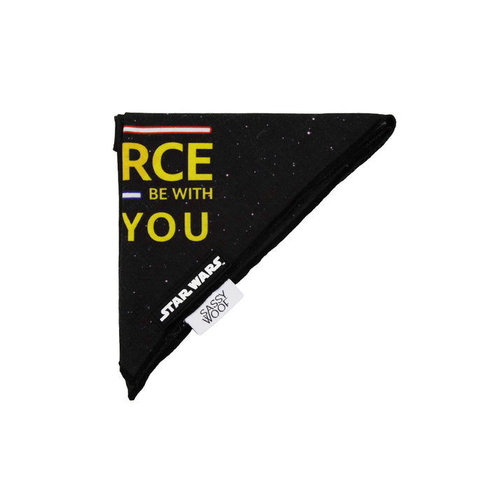 The Sassy Woof Dog Bandana - STAR WARS™ The Force features a black space pattern, yellow "RCE BE WITH YOU" text, and lightweight cotton. Fits necks up to 21.5", available in Small, Medium, and Large sizes. Tags: STAR WARS, SASSY WOOF.