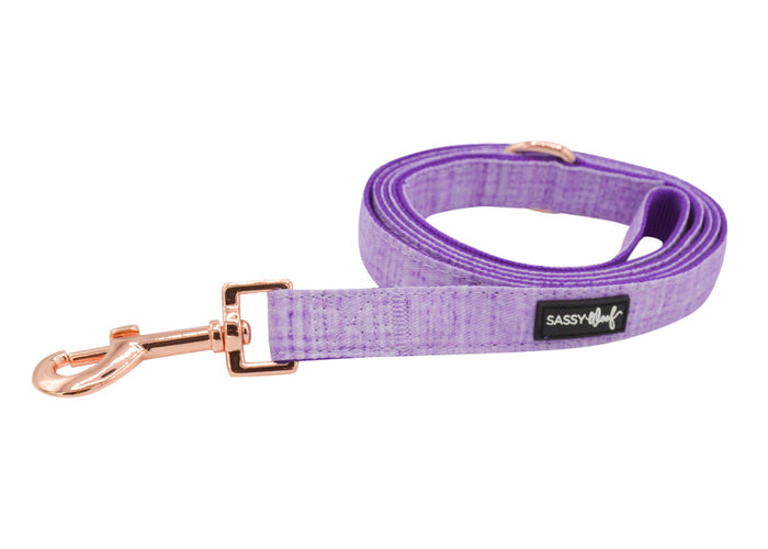 The Dog Leash - Aurora by Sassy Woof features vibrant purple webbing, rose gold hardware, and a black SASSY label—ideal for pairing with matching harness and collar to complete your dog’s coordinated look.
