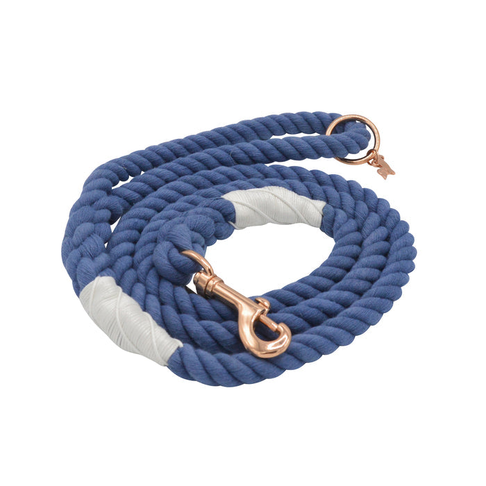 The Sassy Woof Dog Rope Leash - Nautical is a blue cotton coiled leash with white wrapped sections, rose gold hardware, and sturdy metal clip and ring, shown on a white background.