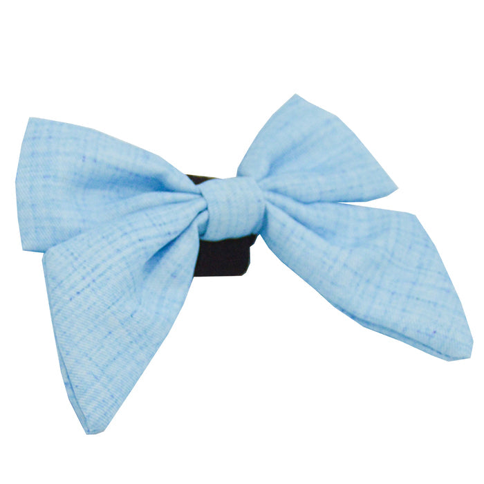 The Sassy Woof Dog Sailor Bow - Blumond features a neatly tied, light blue textured bow on a black clip, shown on a white background. Part of the elegant Blumond collection.