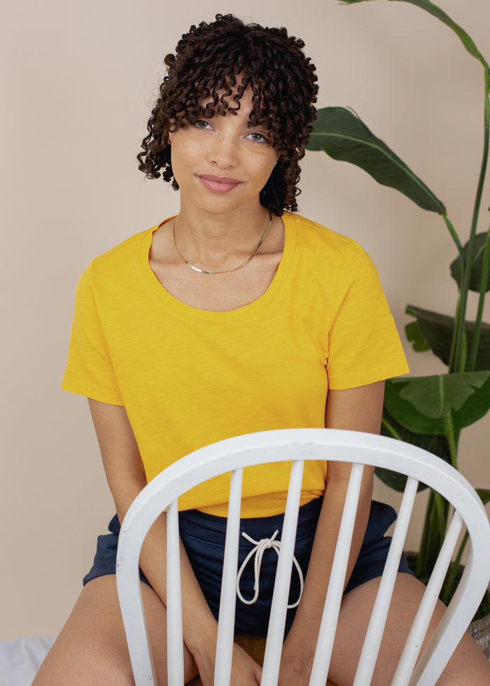 woman wearing relaxed slub tee in gold
