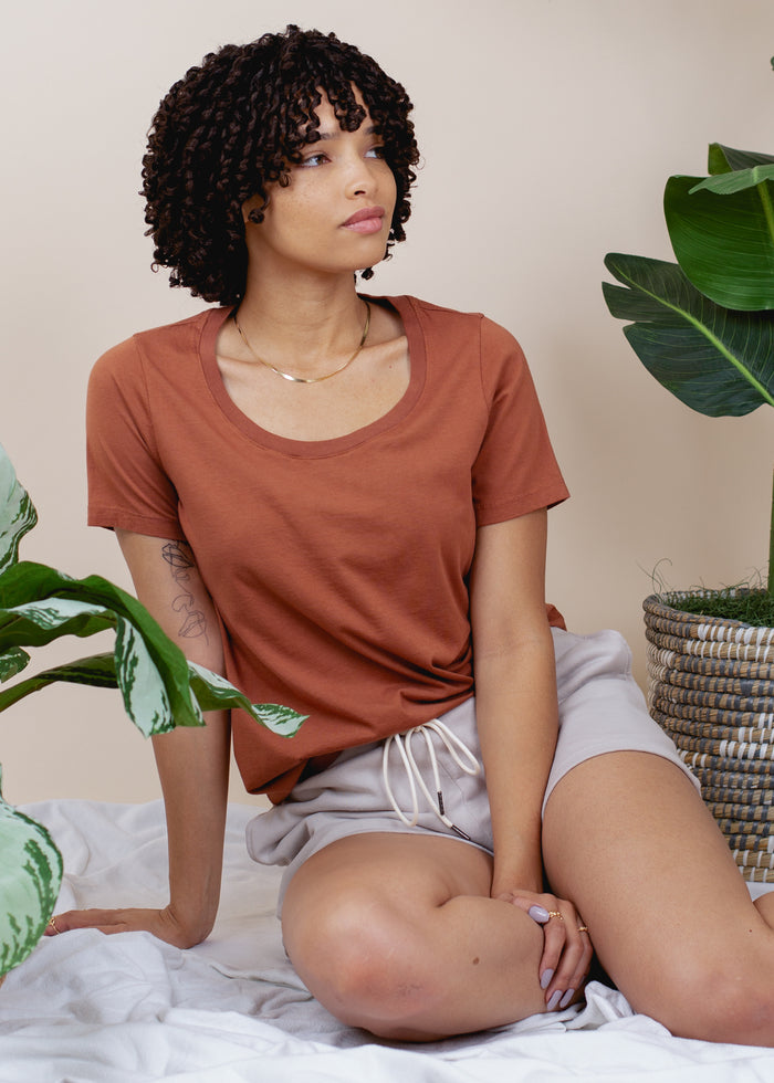 woman wearing relaxed crewneck tee in rust