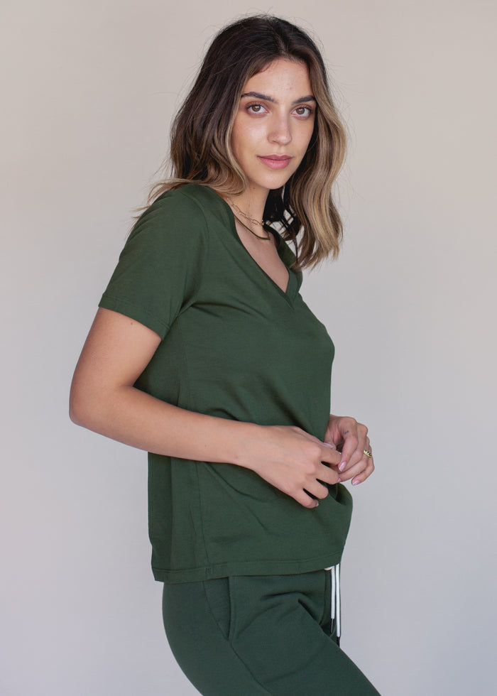 woman wearing green vneck tee