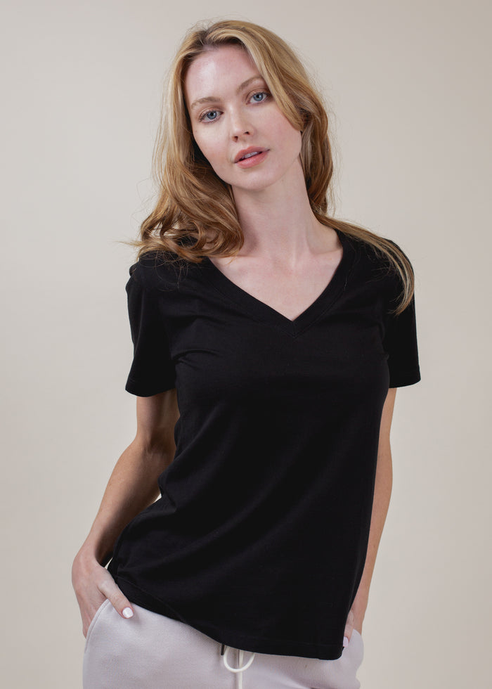 woman wearing black vneck tee