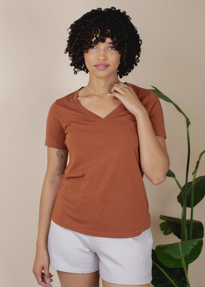 woman wearing rust vneck tee