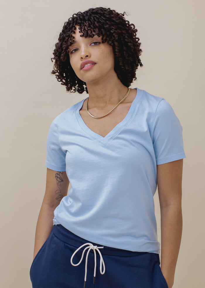 woman wearing sky blue vneck tee