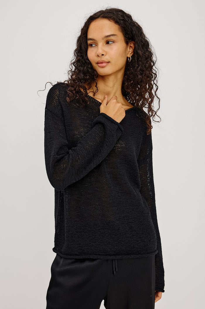 Evangeline Sweater in Luxe Linen Blend With Open Weave, Boat Neck, Relaxed Dropped Shoulders, and Long Sleeves in Black Colorway - Upper Body Front View Featured on Model