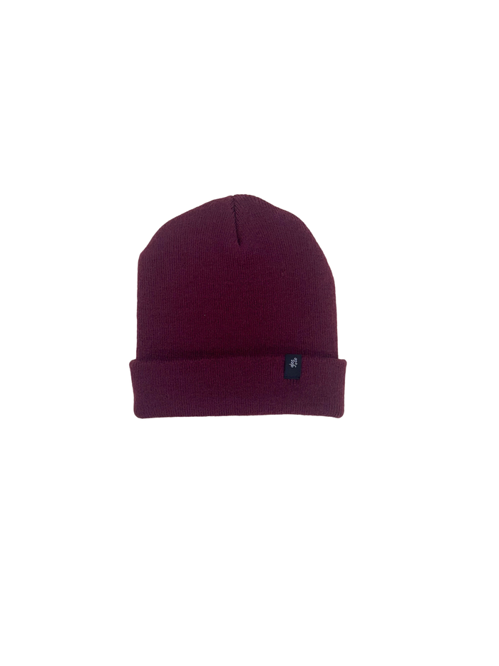 Maroon knit beanie on a light gray background