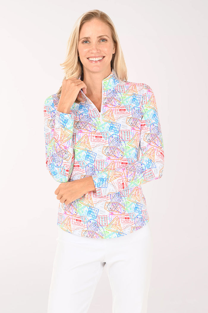 Woman wearing a colorful patterned blouse on a white background
