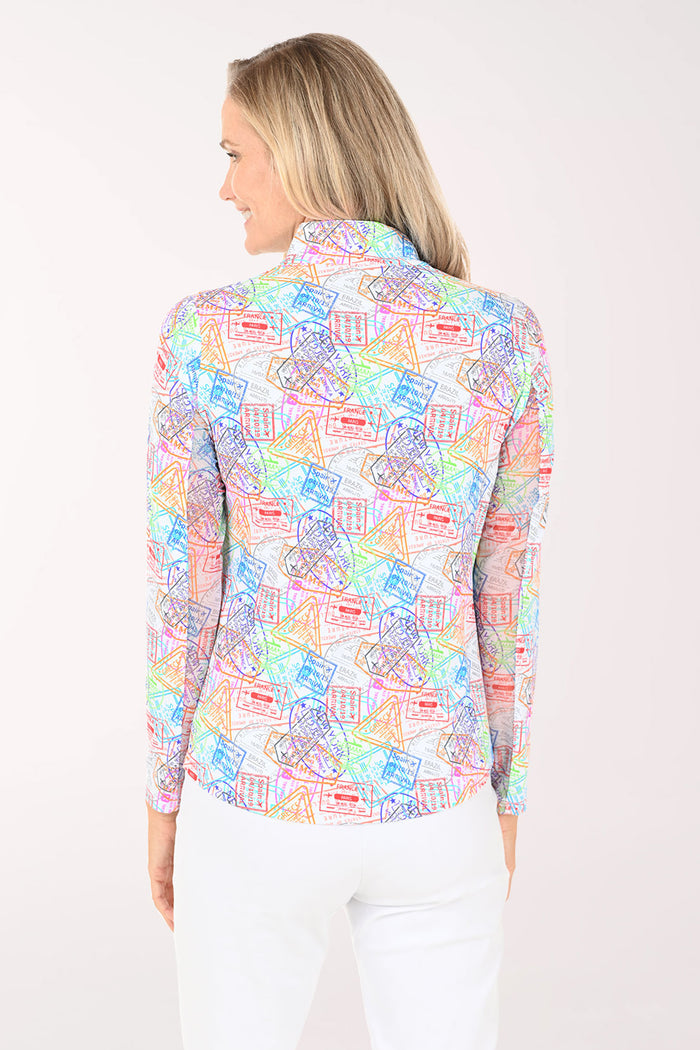 Woman wearing a colorful patterned blouse on a white background