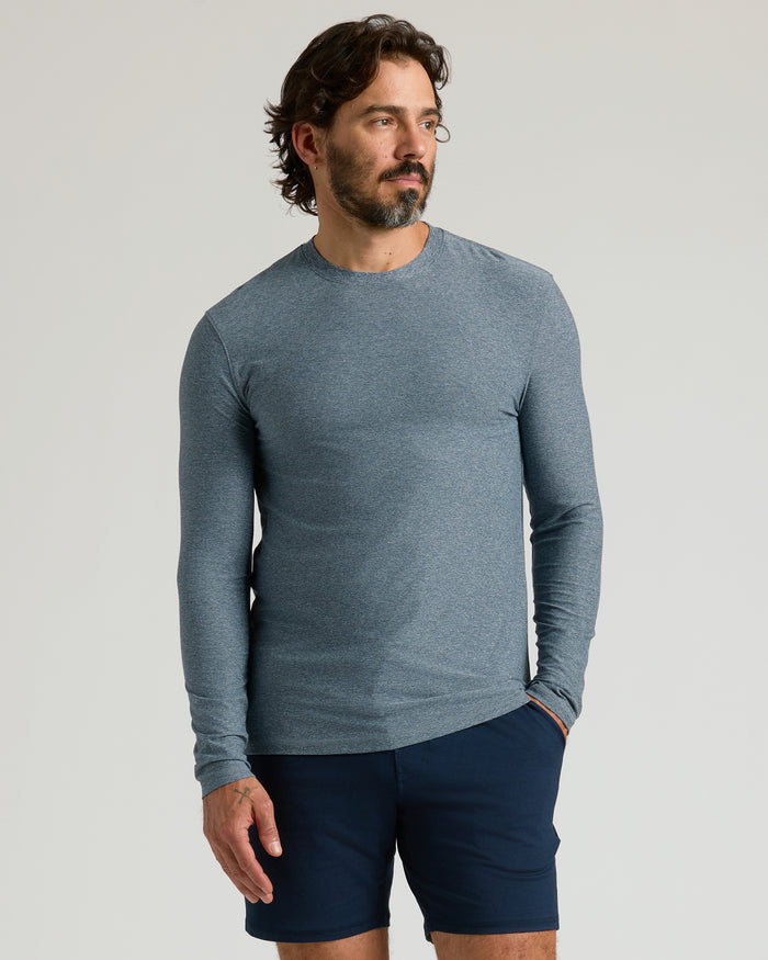 Heather Navy Active Long Sleeve Crew T-Shirt worn by man against plain backdrop.