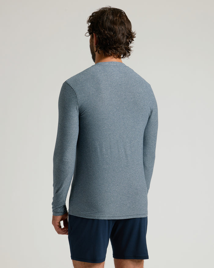 Man wearing Heather Navy Active Long Sleeve Crew T-Shirt, back view.