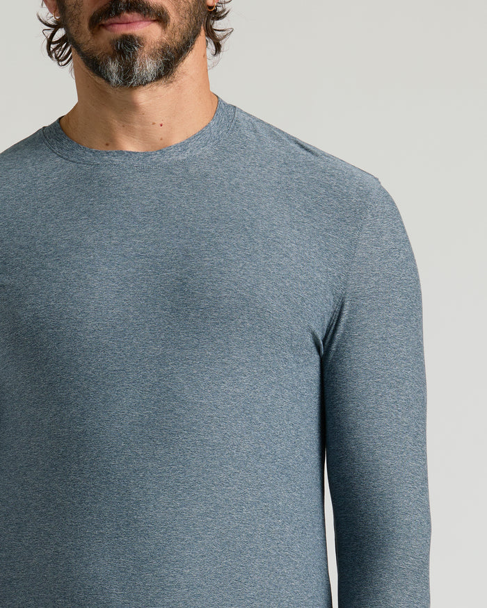 Man wearing Heather Navy Active Long Sleeve Crew T-Shirt, showcasing slim-fit design.