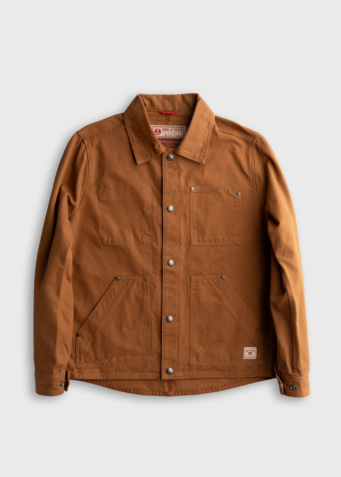 Brown canvas jacket with front pockets and metal buttons, laid flat on a white background. Iron and Resin label visible inside.