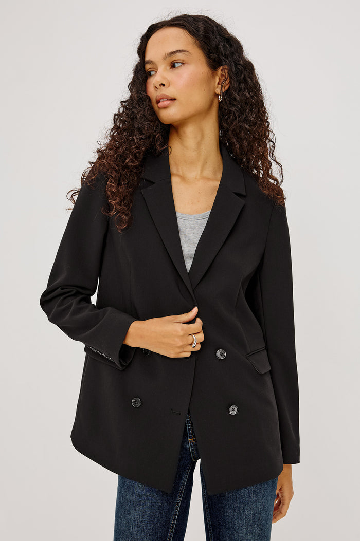 Jac Blazer in Wool Blend With Double-Breasted Design, Notched Lapels, Long Sleeves, Side Flap Pockets, and Fully Lined in Black Colorway - Upper Body Front View Featured on Model