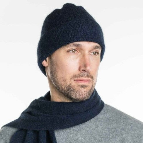 A man wearing an Navy-coloured Koru Merino and Possum Plain Beanie.