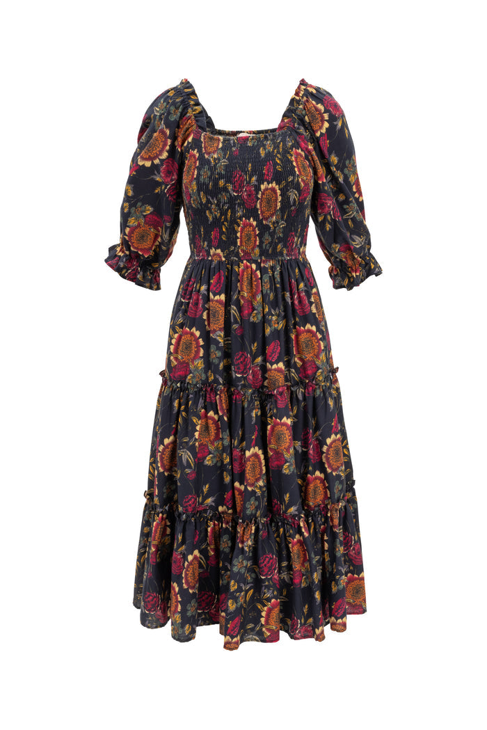 Floral patterned dress with puff sleeves on a white background