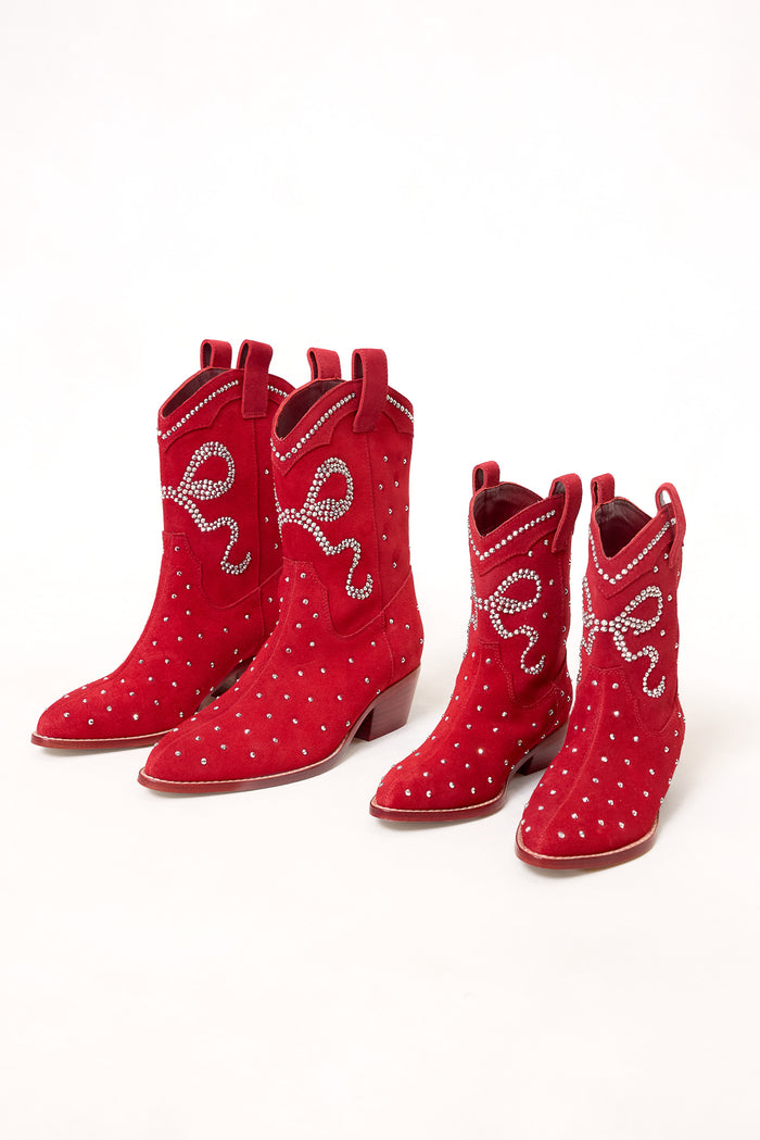 Two pairs of Ivy City Co’s Mini Channing Bootie in Red—one large, one small—feature white studs and rhinestone swirls, styled side by side for a charming mommy-and-me look against a crisp white backdrop.