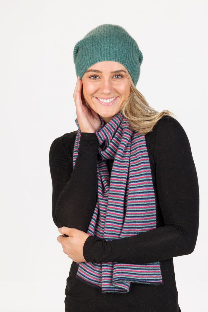Woman wearing Native World - Merino & Possum Six Colour Scarf (NX894) in the colour combination Navy.