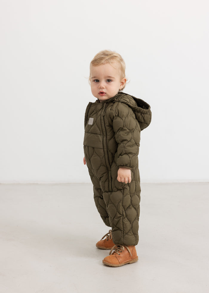 Dark green faux fur jumpsuit with hood, zipper, and quilted pattern