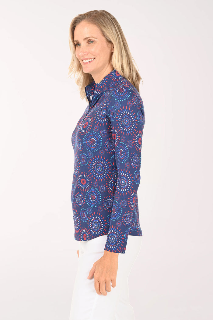 Woman wearing a blue patterned long-sleeve shirt on a white background