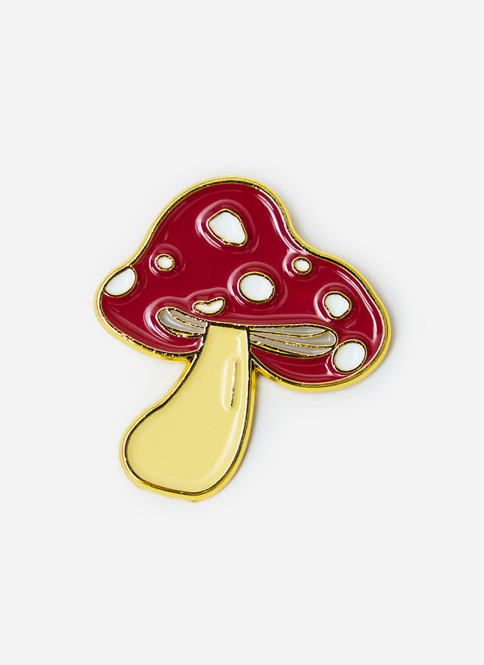 The Percival Mushroom Pin Badge, a red and white toadstool with a gold metal outline, shot on a clean white background.
