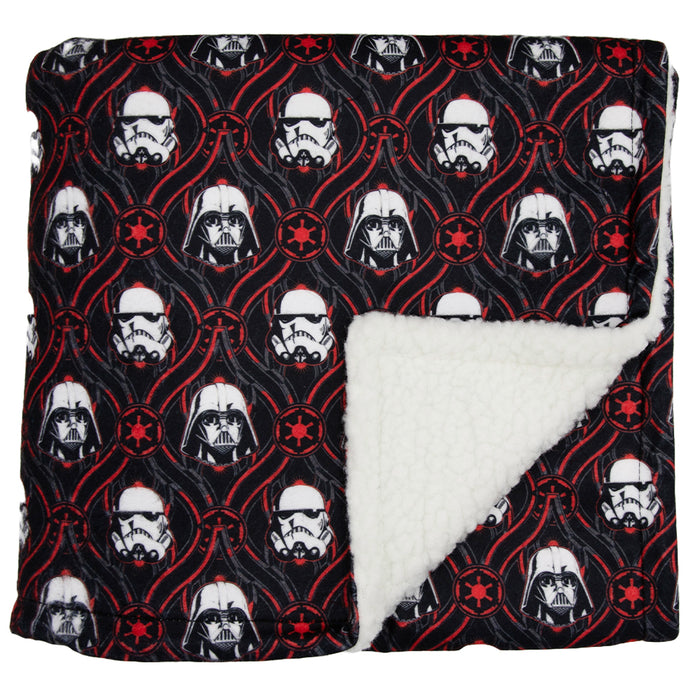 The Sassy Woof Pet Blanket - STAR WARS™ The Dark Side features a cozy microfiber top with Darth Vader and Stormtrooper helmets, red Imperial symbols, and plush white sherpa lining—perfect for your pet to snuggle in.
