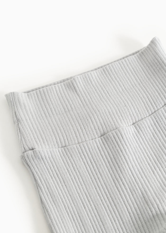 Piva ribbed pants in light gray with a folded edge at the thigh and seam.